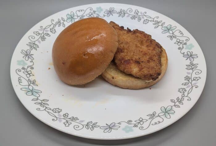 A toasted Specially Selected Brioche Bun with a Kirkwood Breaded Chicken Breast Fillet.
